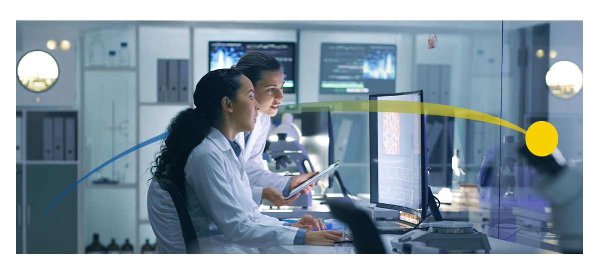 Two female radiologists look at a scan