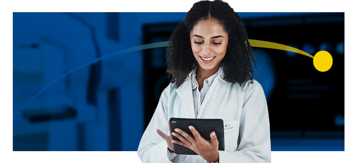 A woman with curly hair in a white jack holds a tablet