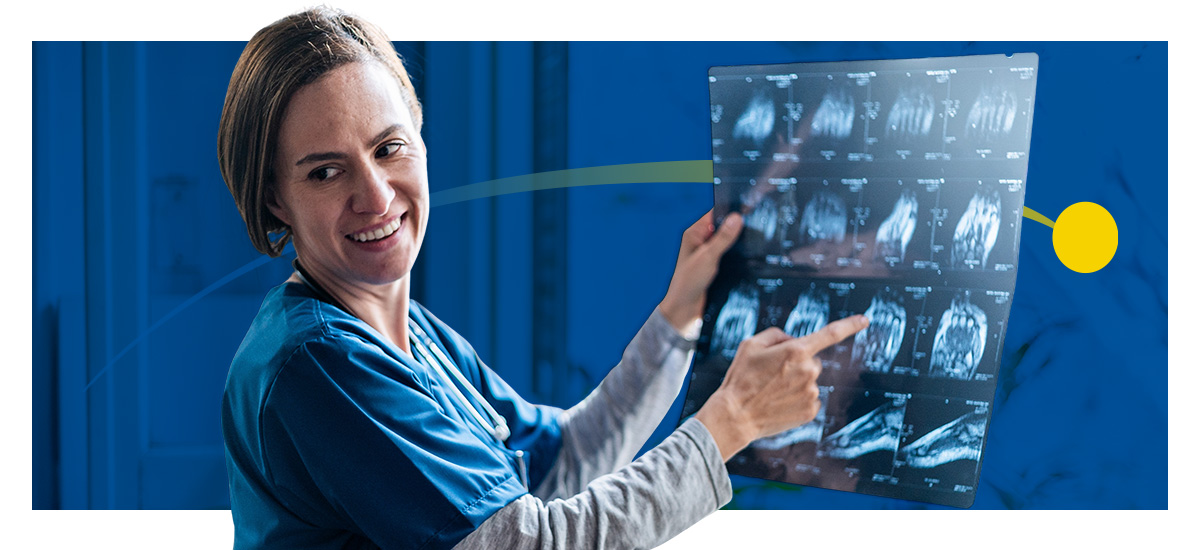 A female radiologist views a scan