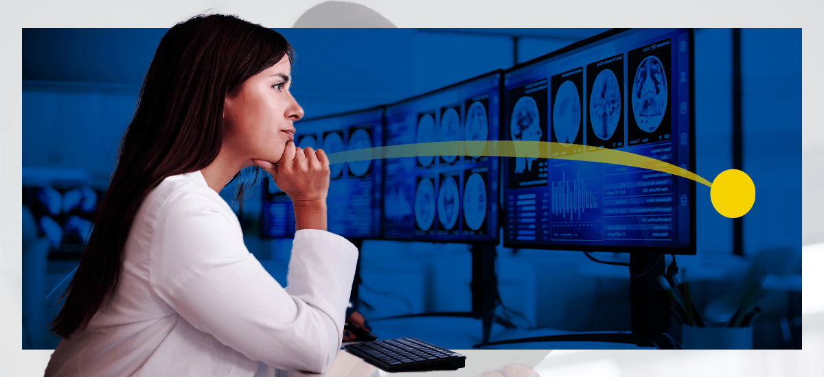 A female radiologist looks at results on a computer
